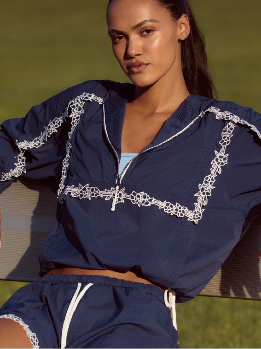 Navy Women's Embroidered zip pullover.
